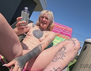 101525_hot_model_brille_oils_herself_up_while_sunbathing_nude_outdoors_and_touching_fingering_her_tight_shaved_pussy